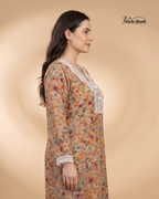 Woman wearing a floral dress with lace details on a beige background, featuring the brand 'Style Hook'.