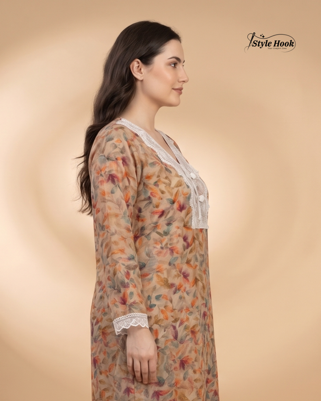 Woman wearing a floral dress with lace details on a beige background, featuring the brand 'Style Hook'.