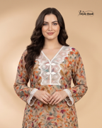 Woman wearing a floral dress with lace details on a beige background, branded 'Style Hook'.